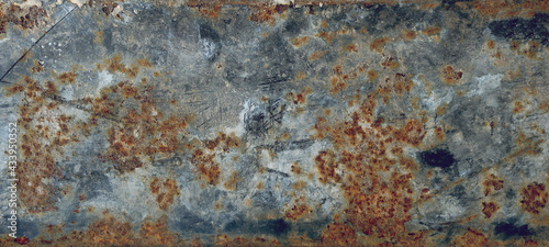 rusty metal surface with black and orange tones - worn steampunk background with scratches for a wallpaper © Domingo