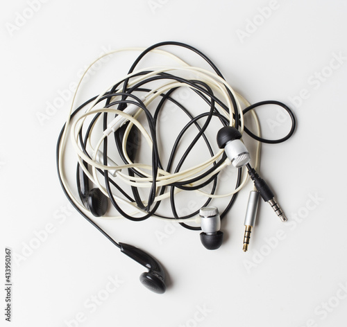 messy wire earphone Twisted on white background