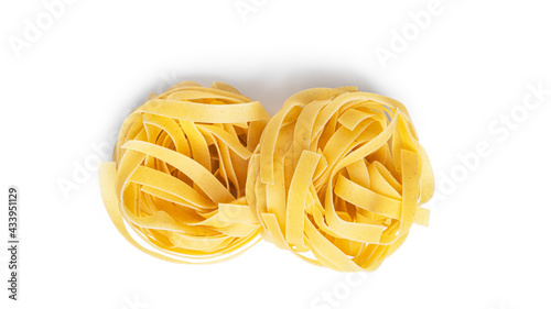 Fettuccine pasta isolated on a white background. Pasta nests.