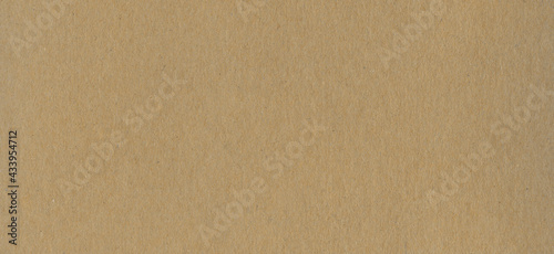 Clean brown cardboard paper background texture. Horizontal banner
