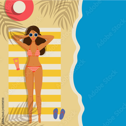 Beautiful young girl on the beach in a bikini.