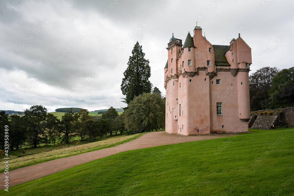 Craigievar Castle in Scotland. The pinkish castle is a superb example of the original Scottish baronial style, dating from 1626.