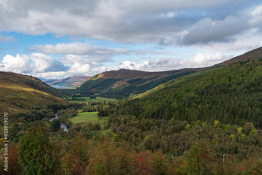 Autumn landscape with river Abhainn Droma in Scotland.