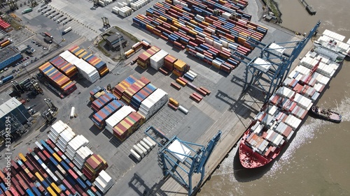 Fotografia Tilbury Docks on River Thames UK container ships loading overhead aerial view