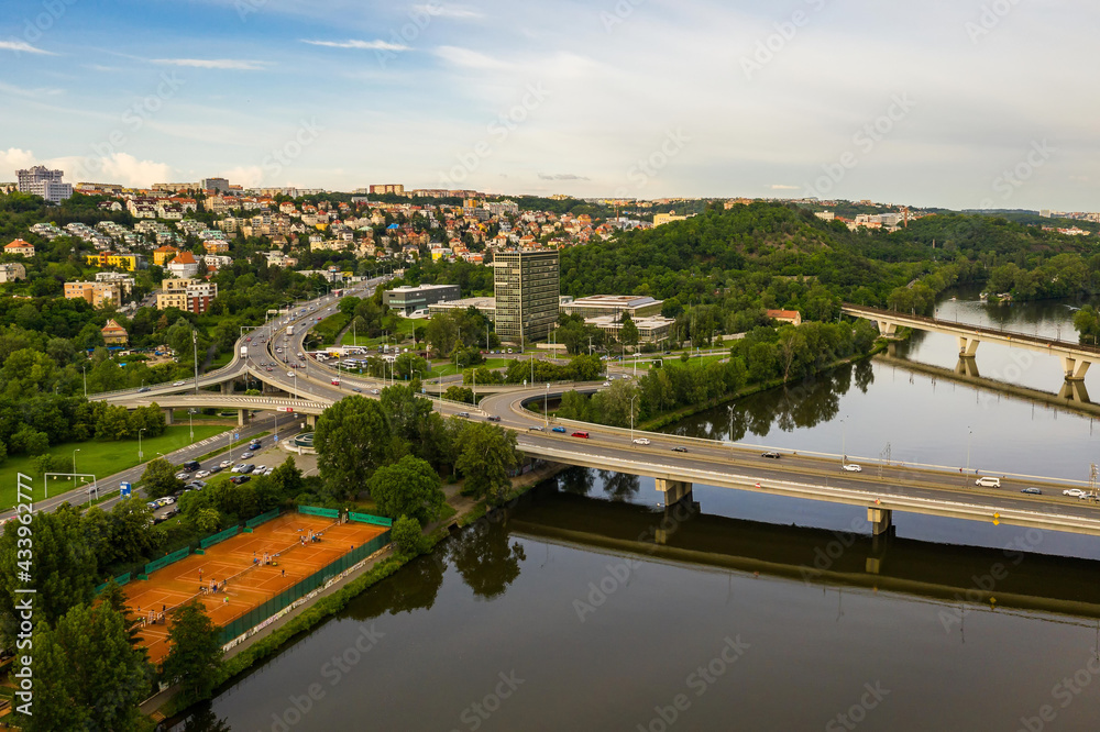 Aerial view of the railway bridge and the bridge for cars in Prague, which connects Prague 7 Holesovice and Prague 8. Beautiful view of the city in a summer day.