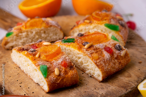 Coca de sant joan. Traditional San Juan cake to celebrate the arrival of summer in Spain made with brioche bread, candied fruit and nuts.