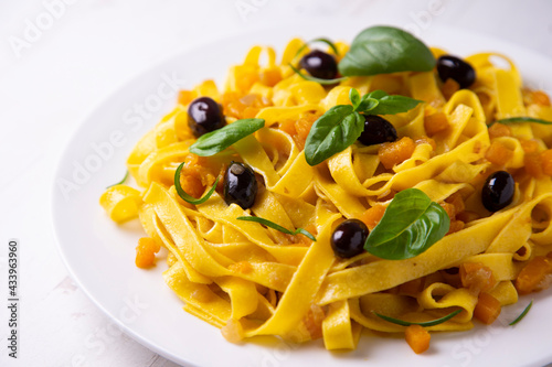 Fresh pasta with olives and pumpkin