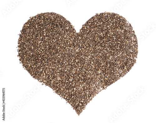 Heart symbol made of chia seeds on white background