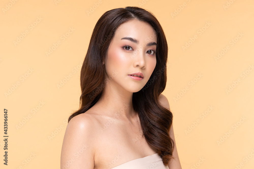 Wellness Asian young woman looking at camera clean fresh and nutural pure skin,Pretty girl smile with be moist skin on her face shining like a model,Facial treatment of beauty woman,isolated on Beige Wellness Asian young woman looking at camera clean fresh and nutural pure skin,Pretty girl smile with be moist skin on her face shining like a model,Facial treatment of beauty woman,isolated on Beige