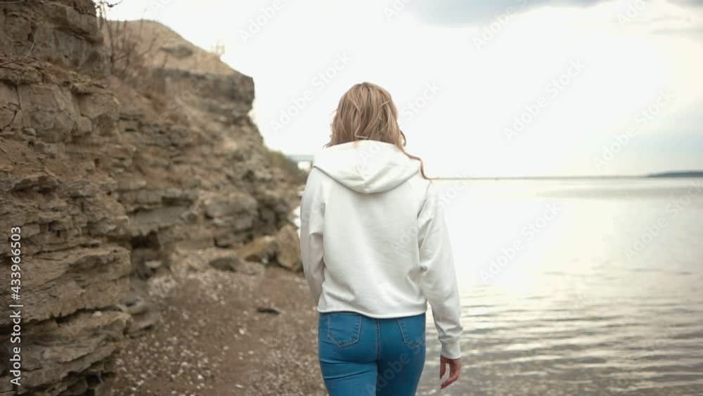 Portrait of an attractive girl in nature. Blonde for a walk. Portrait of an attractive girl in nature. Blonde for a walk.