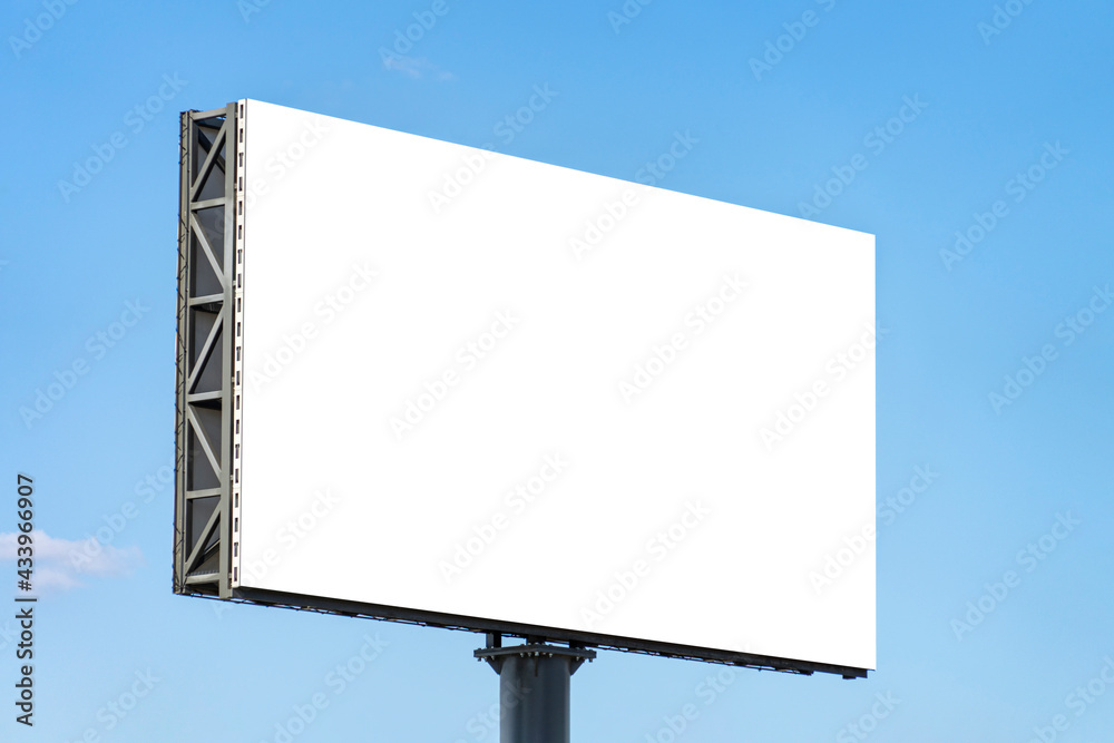 Fototapeta premium Blank big billboard against blue sky background. White horizontal board mock up for advertising, marketing, information