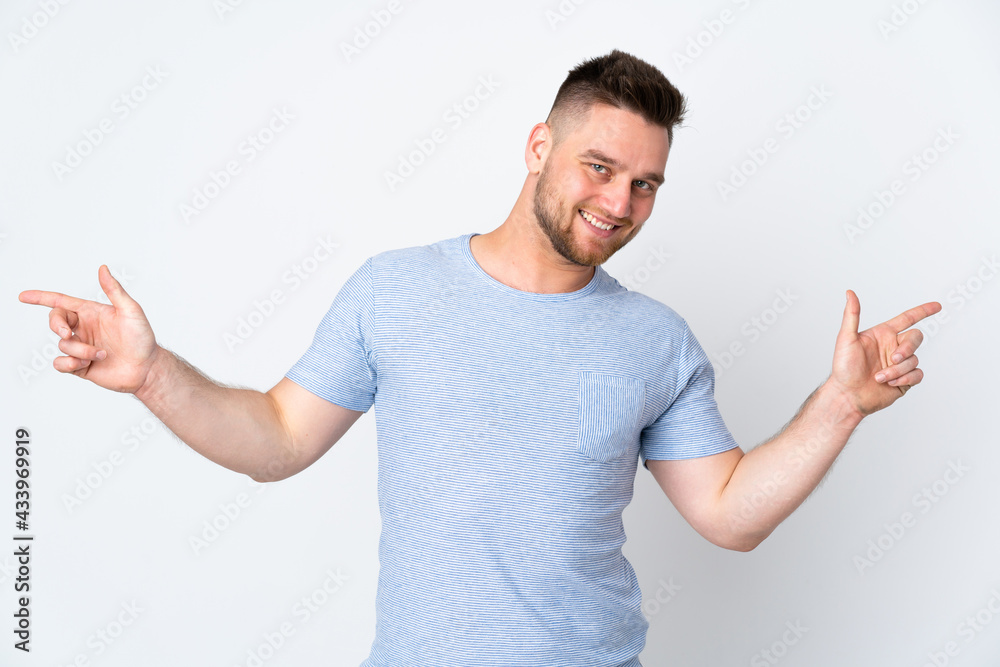 Russian handsome man over isolated background pointing finger to the laterals and happy Russian handsome man over isolated background pointing finger to the laterals and happy