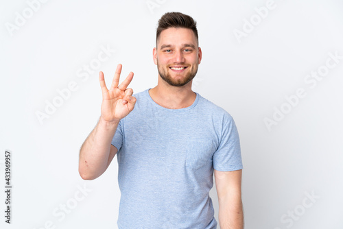 Russian handsome man over isolated background happy and counting three with fingers