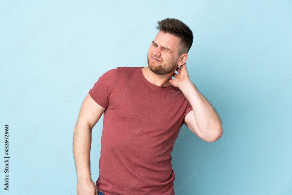 Russian handsome man over isolated background with neckache Russian handsome man over isolated background with neckache