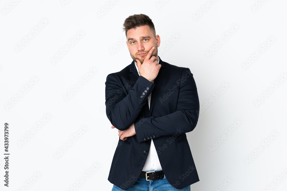 Young Russian business man isolated on white background thinking an idea Young Russian business man isolated on white background thinking an idea