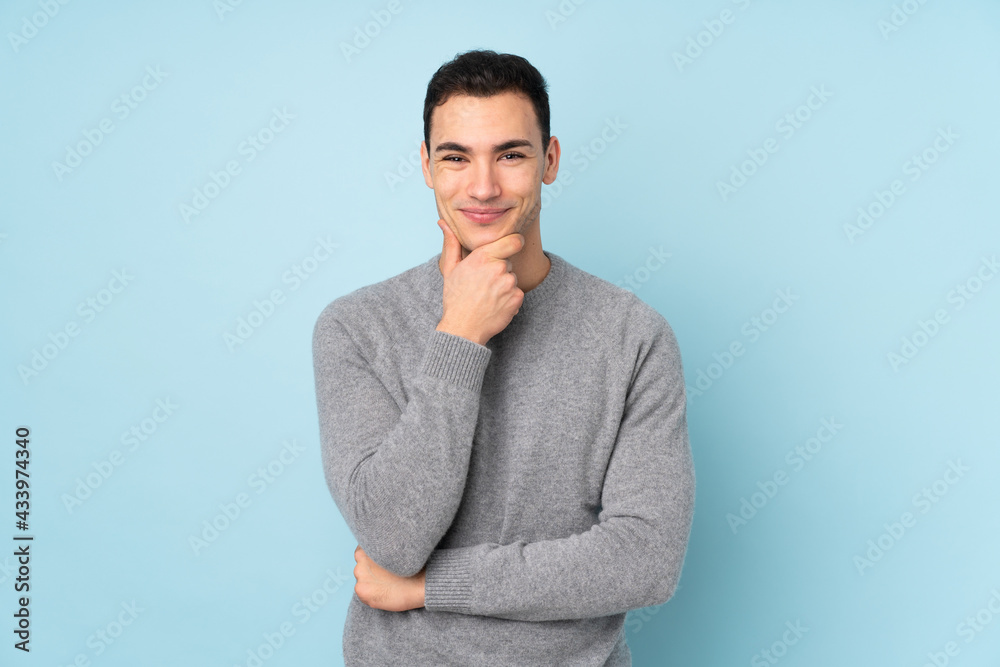 Young caucasian handsome man isolated on blue background laughing Young caucasian handsome man isolated on blue background laughing