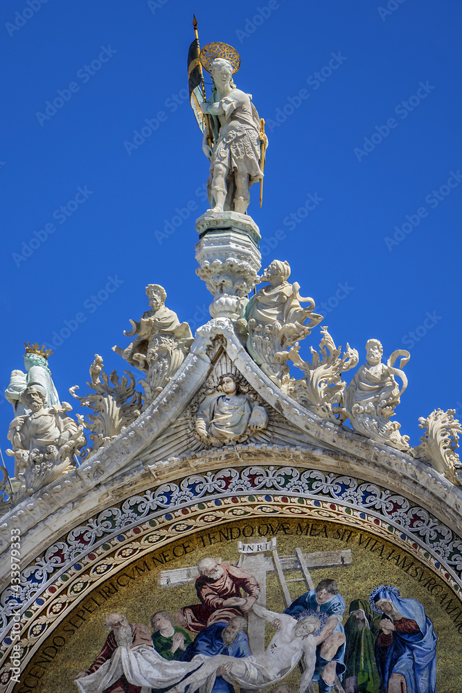 Architectural fragment of the facade of Patriarchal Cathedral Basilica of Saint Mark at Piazza San Marco, Venice, Italy.