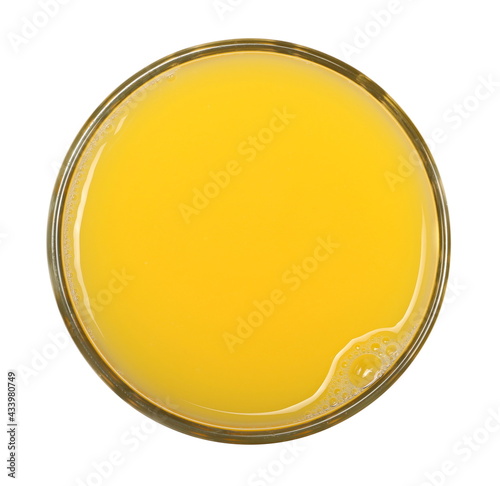 Orange juice in glass isolated on white background, top view