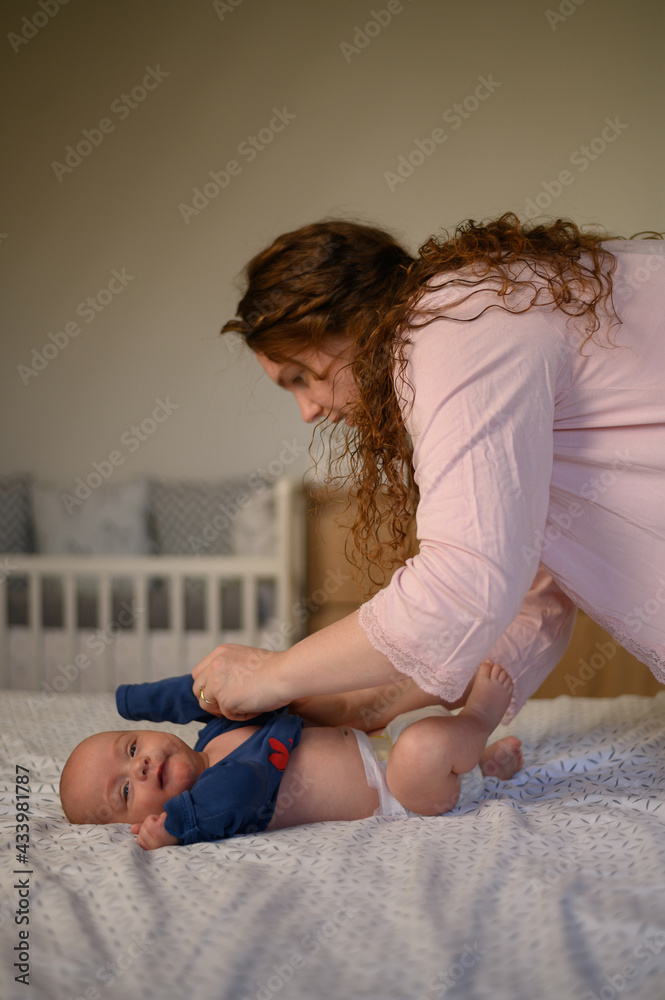 Mother bonding and playing with her baby boy Mother bonding and playing with her baby boy