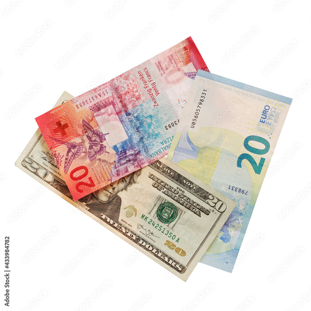 US dollar Swiss franc and euro banknotes on white US dollar Swiss franc and euro banknotes on white