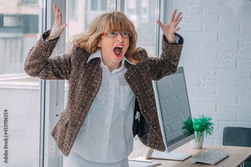 angry business woman screaming in the office