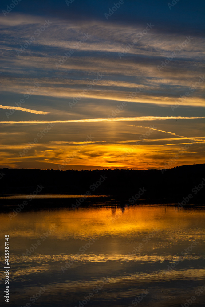 Beautiful colored sunset over a calm lake