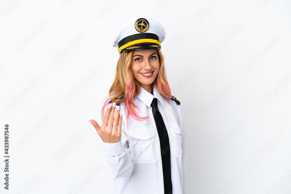 Airplane pilot over isolated white background inviting to come with hand. Happy that you came Airplane pilot over isolated white background inviting to come with hand. Happy that you came
