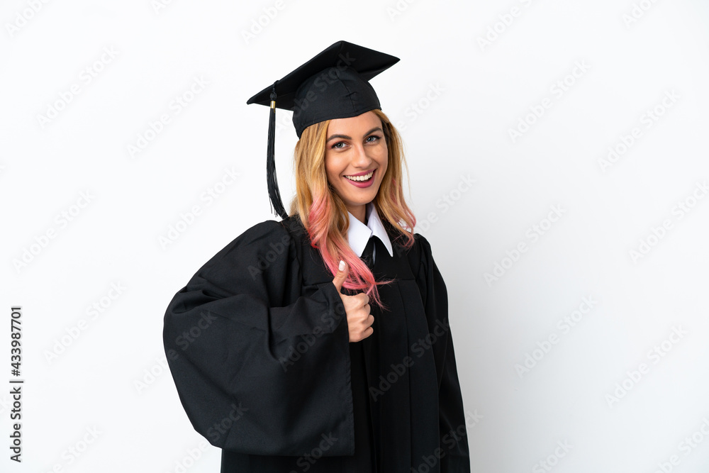 Young university graduate over isolated white background giving a thumbs up gesture Young university graduate over isolated white background giving a thumbs up gesture