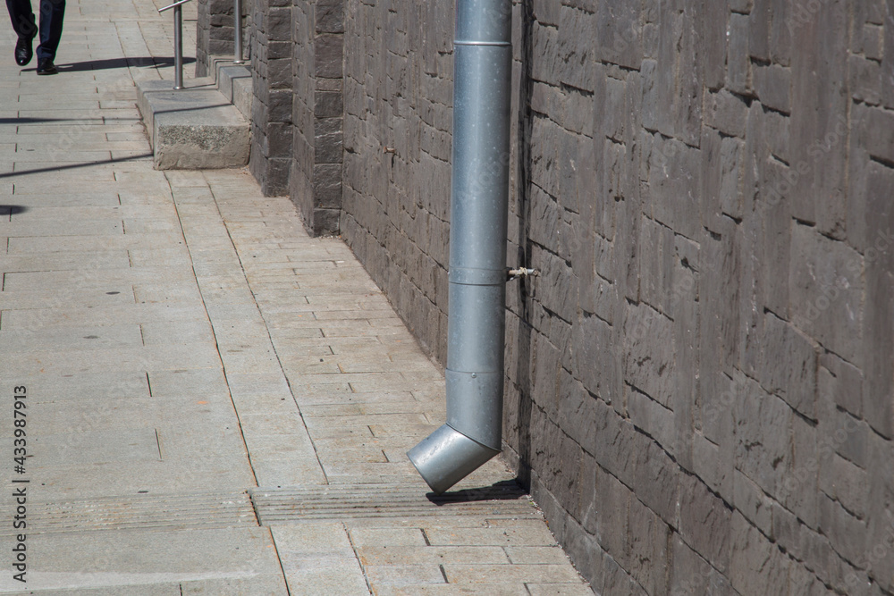 Roof drain.Design of a gutter on a city street. Roof drain.Design of a gutter on a city street.