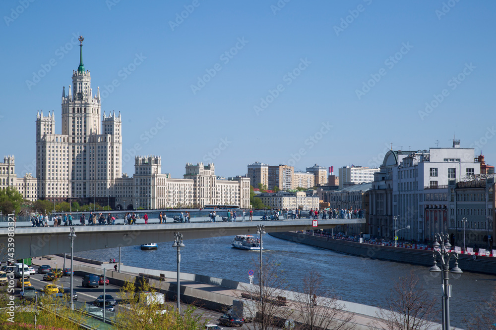 Moscow, Russia, May 11, 2021, Pleasure boats ride on the Moscow River near the Kremlin. Moscow, Russia, May 11, 2021, Pleasure boats ride on the Moscow River near the Kremlin.