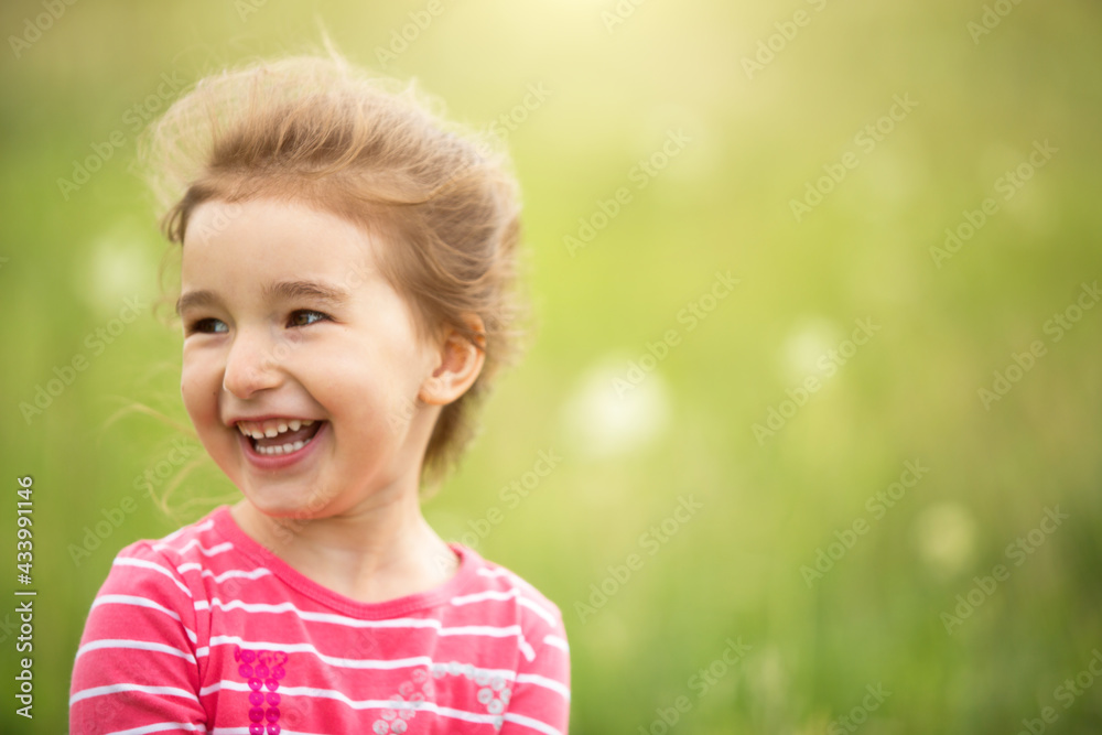 Portrait of a cute girl in field with a wild flower. Childhood, holidays in the country, freedom and carelessness. Summer time. International Children Day. Mosquito repellent, cottage core. Copy space Portrait of a cute girl in field with a wild flower. Childhood, holidays in the country, freedom and carelessness. Summer time. International Children Day. Mosquito repellent, cottage core. Copy space
