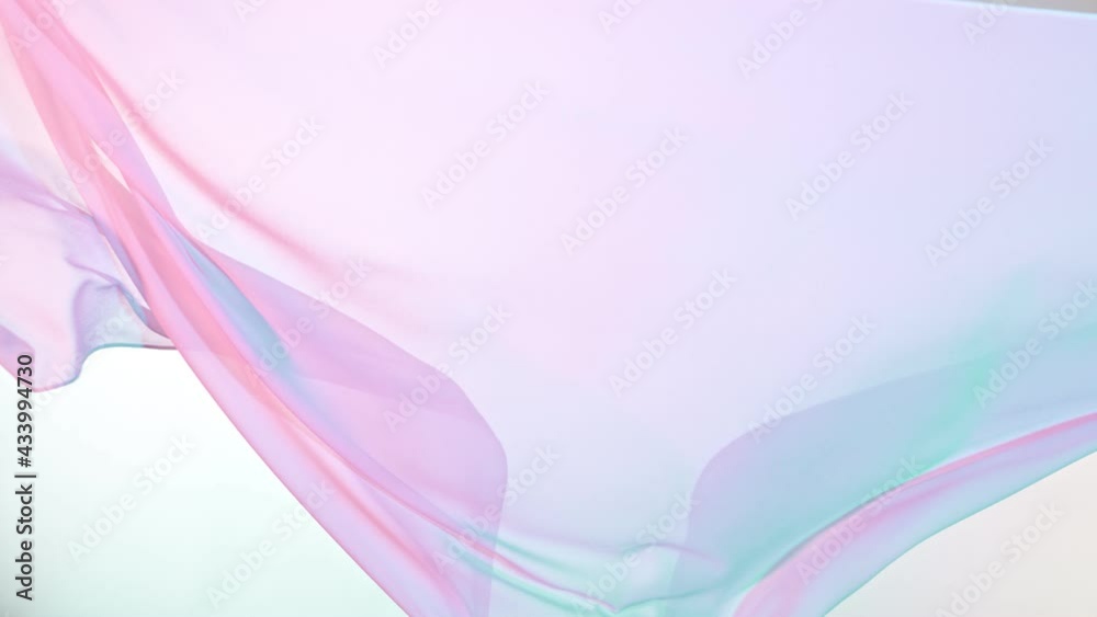 Pastel color transparent silk fabric flowing by wind, super slow motion filmed on high speed cinematic camera at 1000 fps