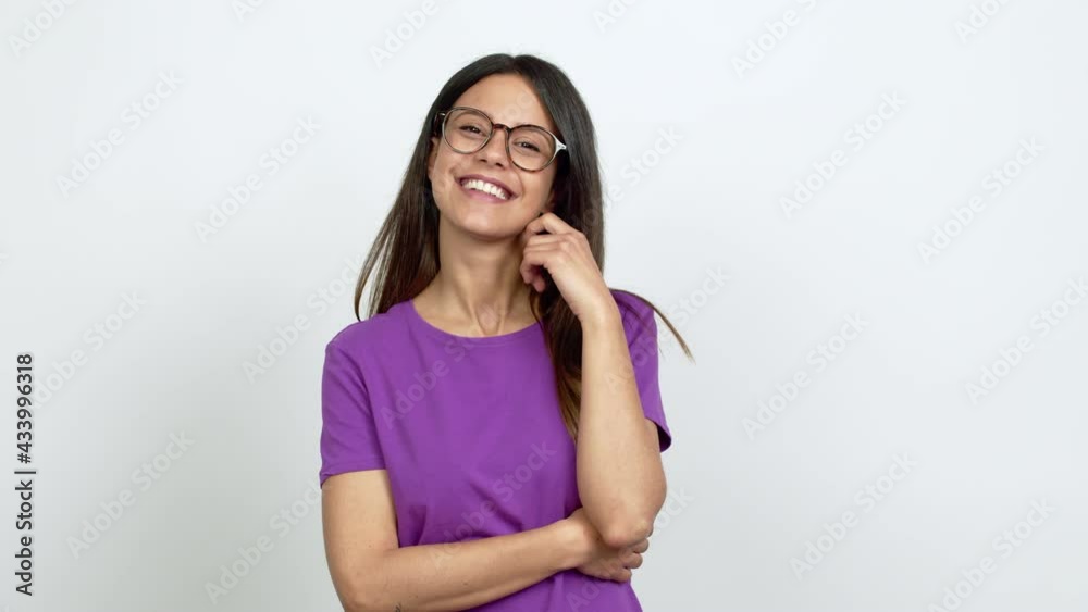 Young woman with glasses smiling and looking to the front with confident face over isolated background Young woman with glasses smiling and looking to the front with confident face over isolated background