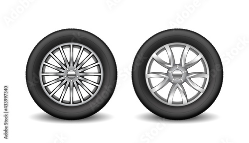 Pair of auto tires with protective rubber rims and metal disks for car safety and driving