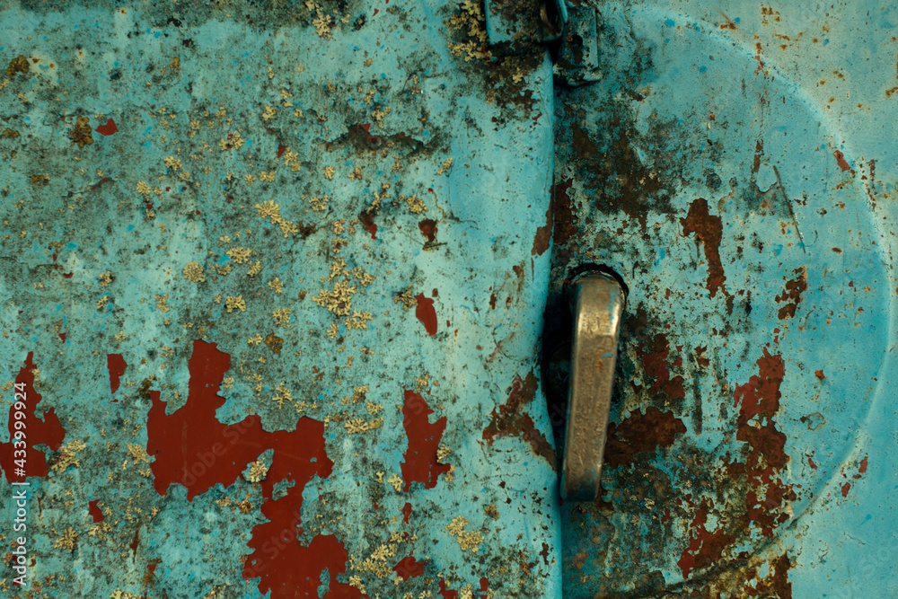 Abandoned objects, texture old rusty metal wall and door with peeling paint. Abandoned objects, texture old rusty metal wall and door with peeling paint.