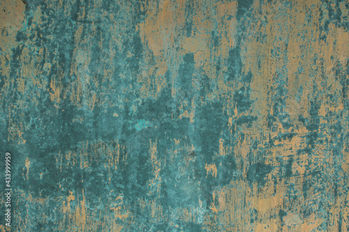 The texture of a worn metal surface with traces of old paint.