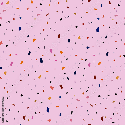 seamless abstract pattern of small angular motley shapes on a pink background for prints on fabrics for bed linen and light clothes, as well as for decoration of premises in a festive style