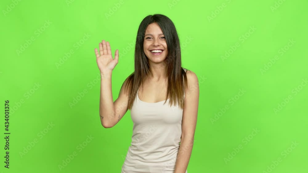 Young woman saluting with hand with happy expression over isolated background Young woman saluting with hand with happy expression over isolated background