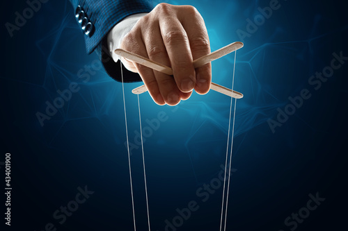 The puppeteer's hand is large. The concept of world conspiracy, world government, manipulation, world control.