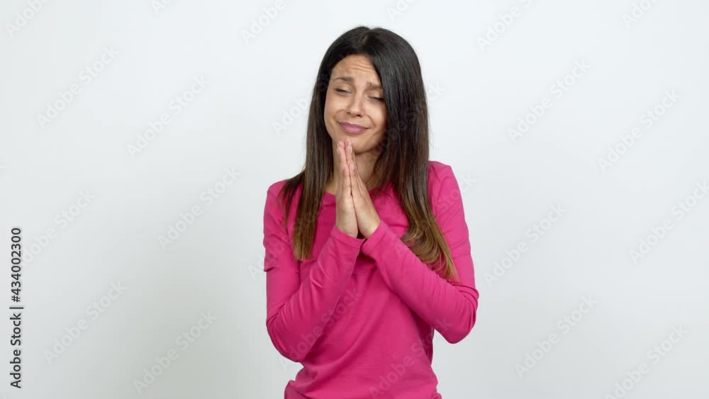 Young woman pleading over isolated background Young woman pleading over isolated background