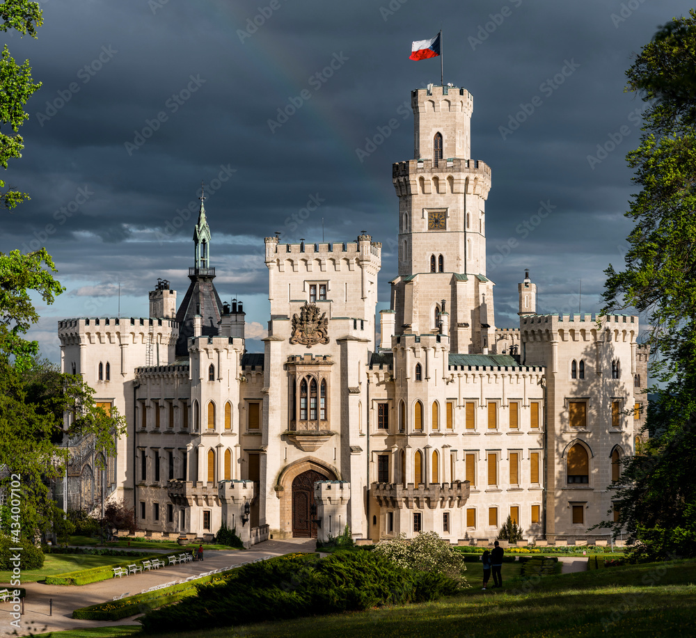 A beautiful view of the neo-Gothic castle Hluboká nad Vltavou on a sunny day.