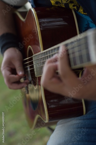 Perfoming in a public place with a red acoustic guitar