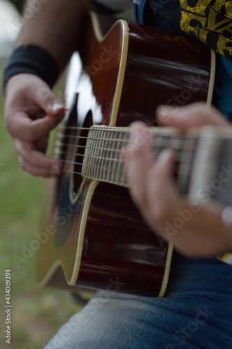 Perfoming in a public place with a red acoustic guitar