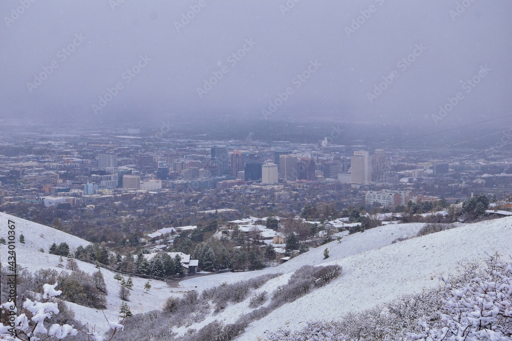 Obraz premium Little Black Mountain Peak hiking trail snow views winter via Bonneville Shoreline Trail, Wasatch Front Rocky Mountains, by Salt Lake City, Utah. United States.