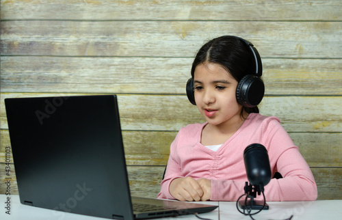 Happy latin girl learning online at home, Online education of children