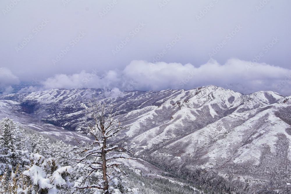 Obraz premium Little Black Mountain Peak hiking trail snow views winter via Bonneville Shoreline Trail, Wasatch Front Rocky Mountains, by Salt Lake City, Utah. United States.