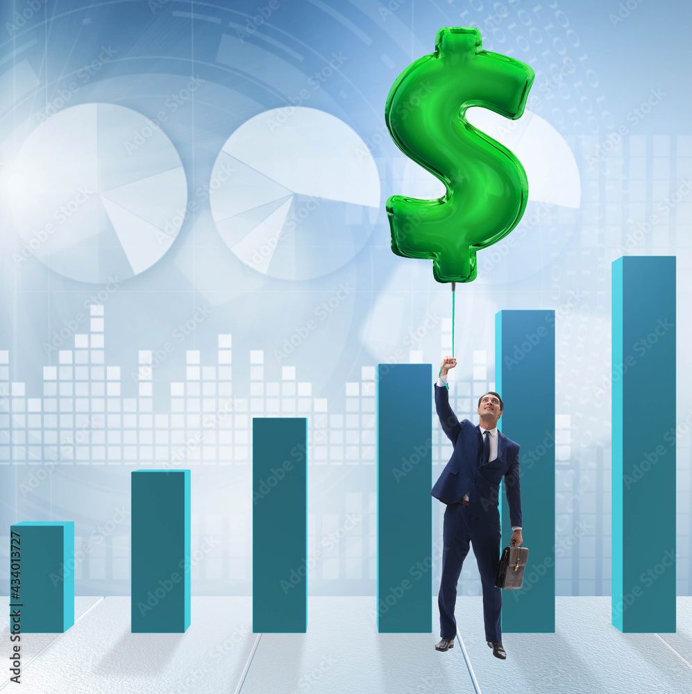 Businessman flying on dollar sign inflatable balloon over financ Businessman flying on dollar sign inflatable balloon over financ