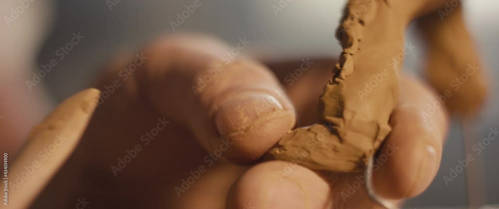 Artist hand shape sculpture tool sculpting clay foot macro close up