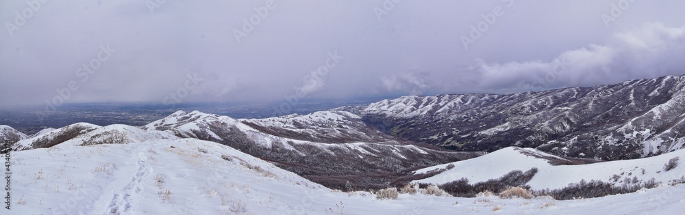 Fototapeta premium Little Black Mountain Peak hiking trail snow views winter via Bonneville Shoreline Trail, Wasatch Front Rocky Mountains, by Salt Lake City, Utah. United States.