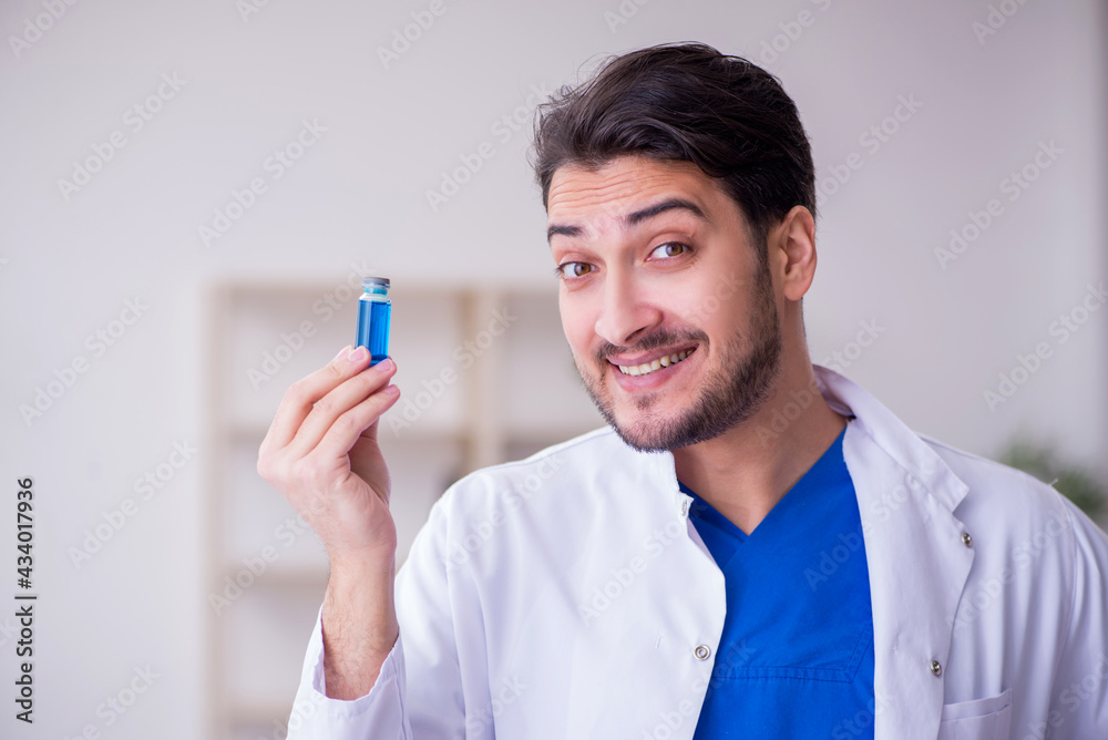 Young male doctor in vaccination concept Young male doctor in vaccination concept